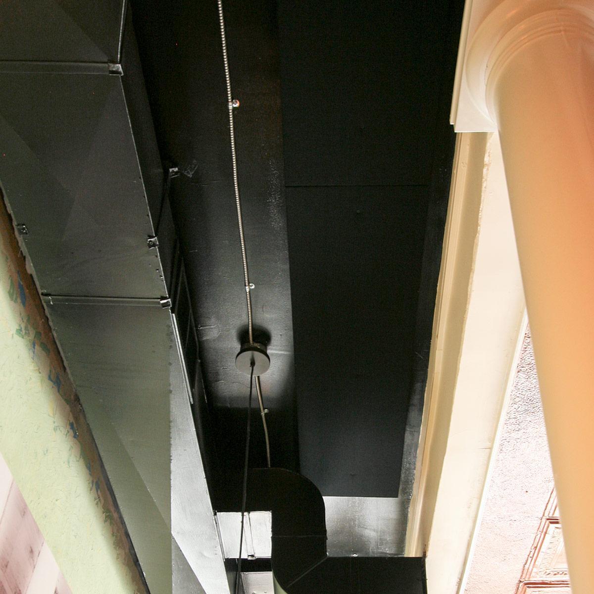 Black AlphaSorb® panels easily blend into a black ceiling to provide sound control in the dining area.