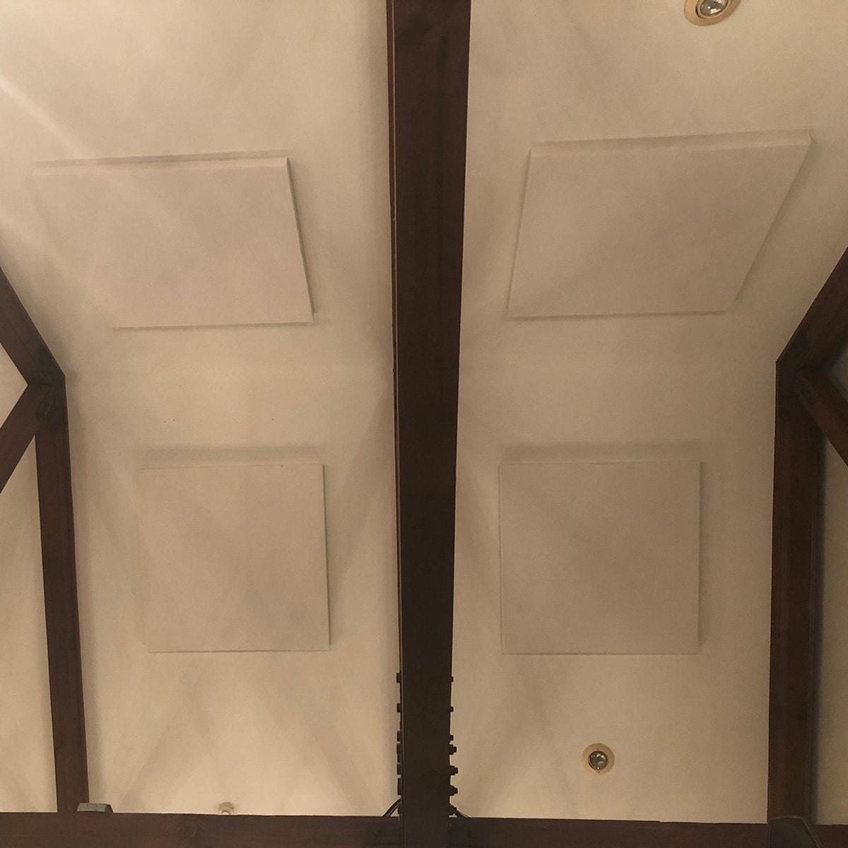 At the Miracle Faith Center, fabric wrapped panels on the ceiling treat the acoustics in the lobby.