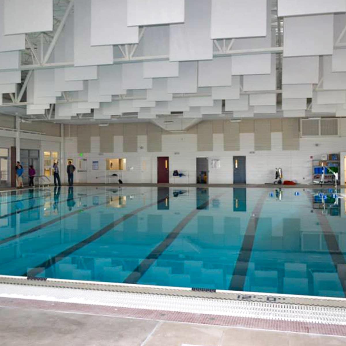 Mission Valley Aquatics improved the acoustics for their indoor pool with a combination of AlphaEnviro® PVC Acoustic Panels and Baffles.