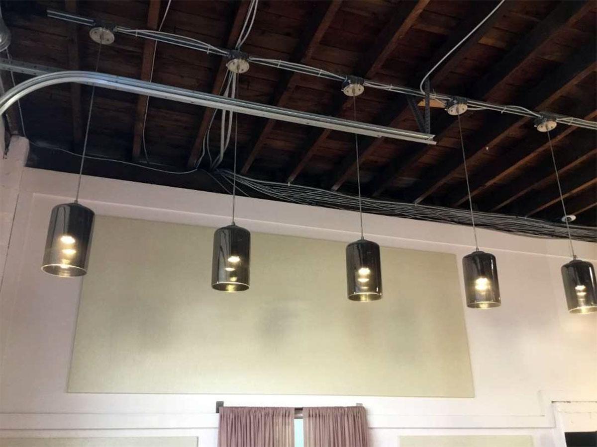 Fabric wrapped panels on the walls of the Moxie Hair Lounge reduce sound intensity and reverberation.