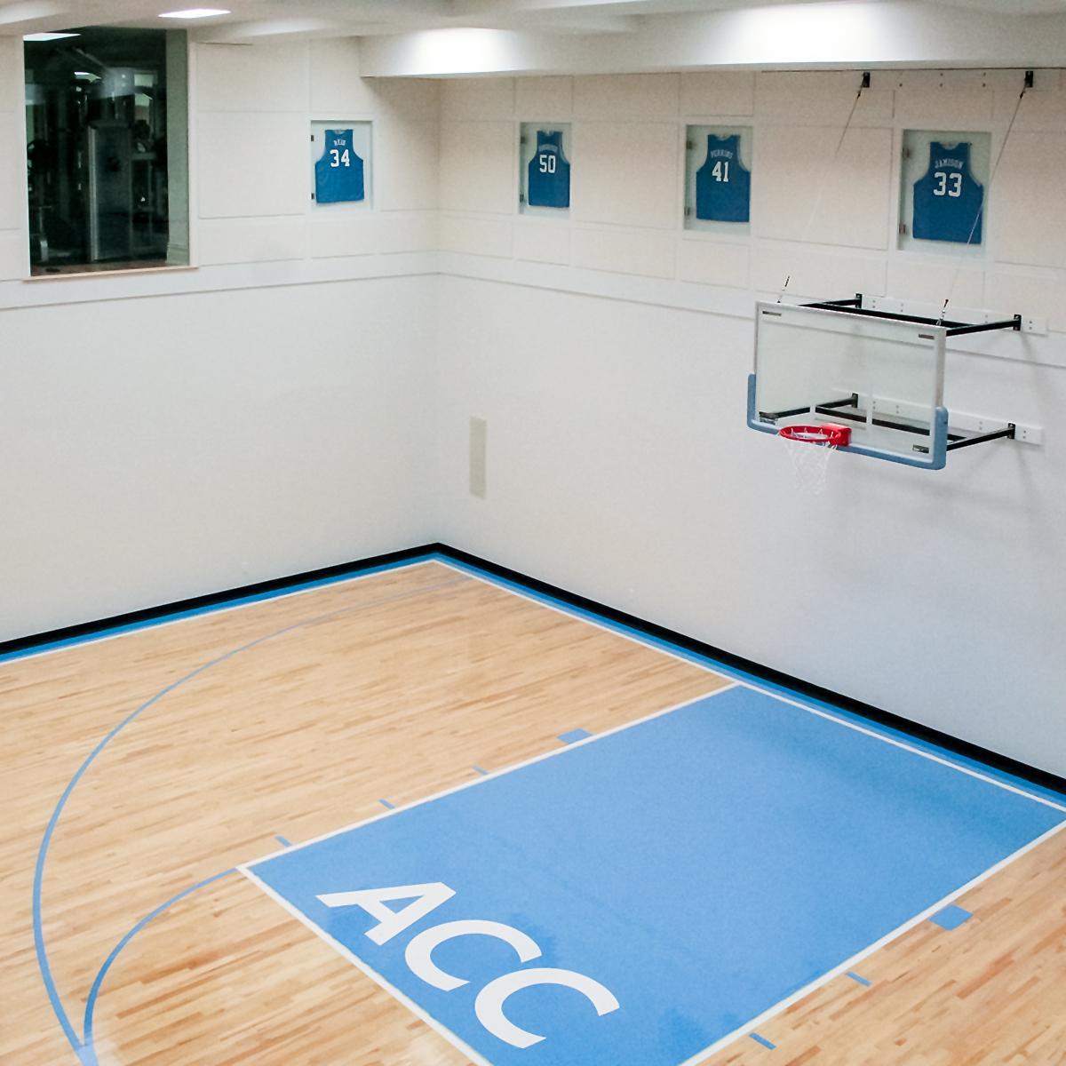 NFL Retiree’s Basketball Court - AlphaSorb® wall panels used on upper walls of home gym.