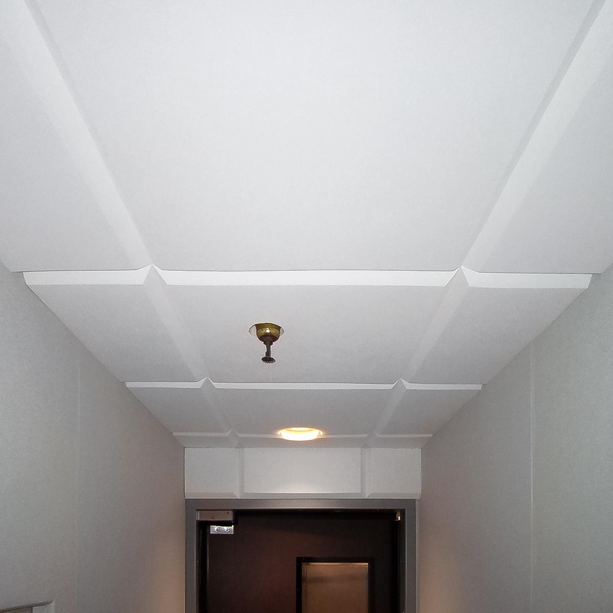 Sonex® Contour Ceiling Tiles mounted directly to the ceiling using adhesive to reduce noise from the kitchen.