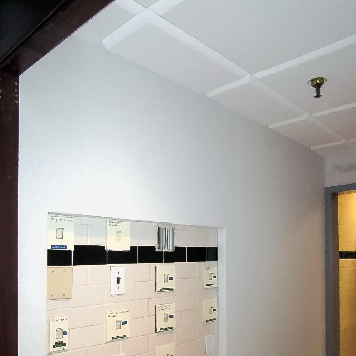 Alcove between restaurant and kitchen using AlphaSorb® Wall Panels and Sonex® Contour Ceiling Tiles to reduce sound from traveling down the hallway.