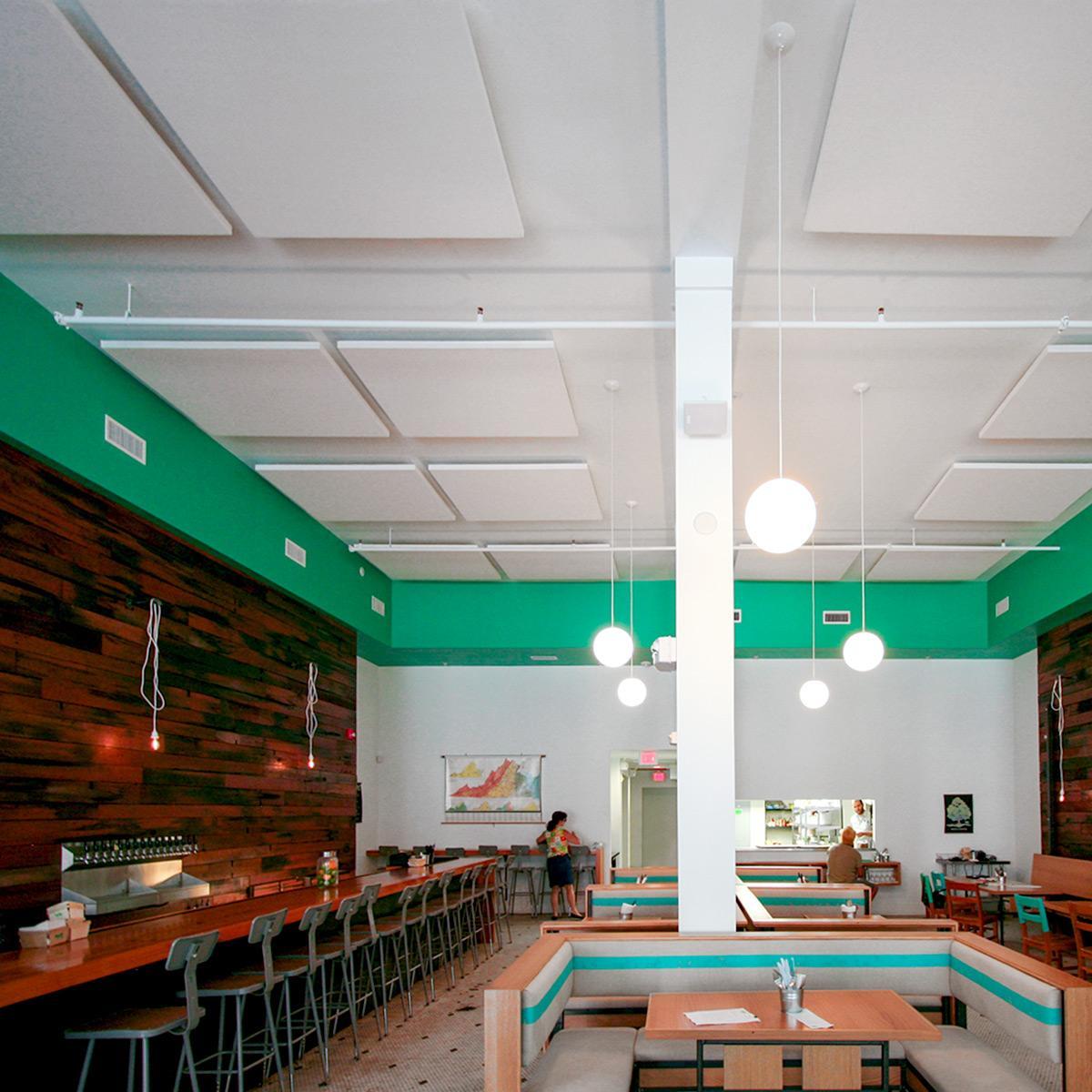At Pasture, acoustic ceiling clouds were installed to reduce reverberation and noise in the dining room.