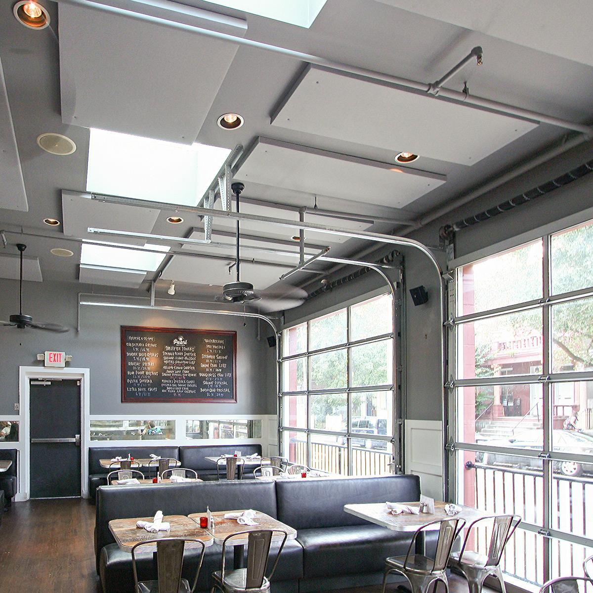 Acoustic ceiling panels reduce overall noise level in an oyster bar.