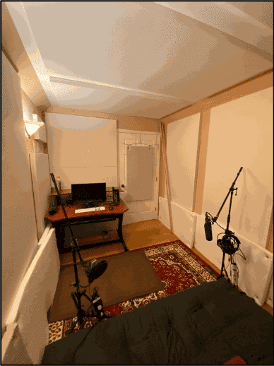 In a podcast studio, fabric wrapped panels and flat foam soundproof the space.