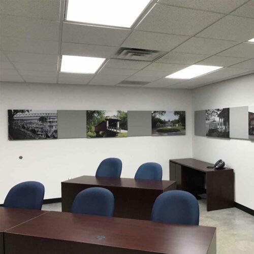 A conference room with acoustic art panels on the wall.