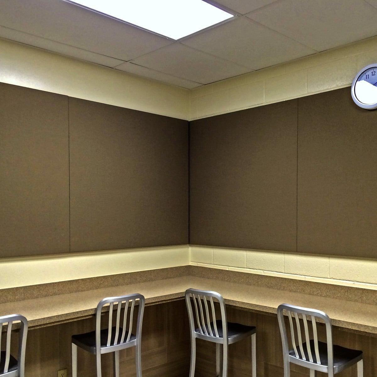 The band of acoustical panels installed in this break room provide a calm and quite place for employees to relax and enjoy their meals.