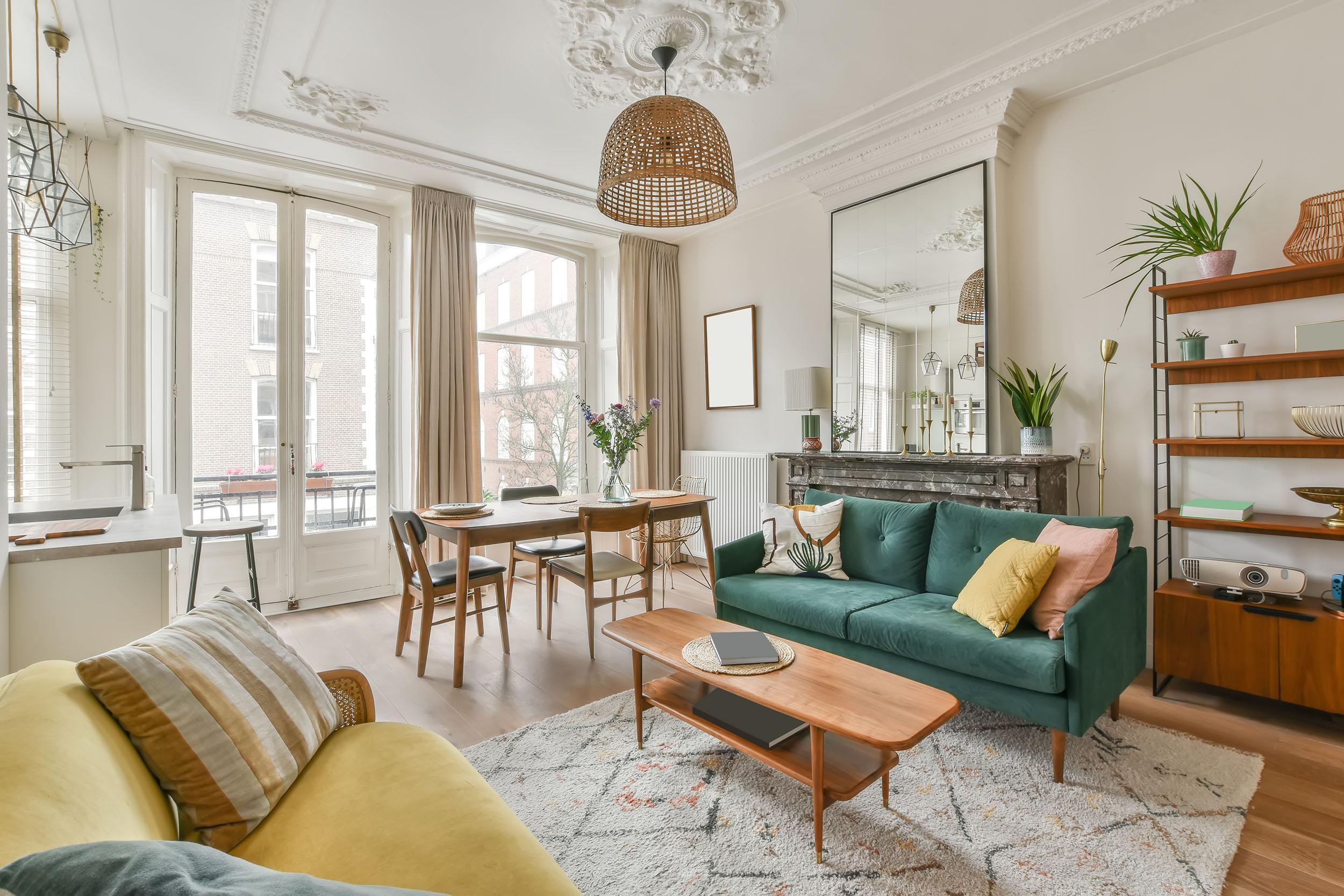 Modern townhouse combined living room dining room space. Photo by ProCreators on iStock.