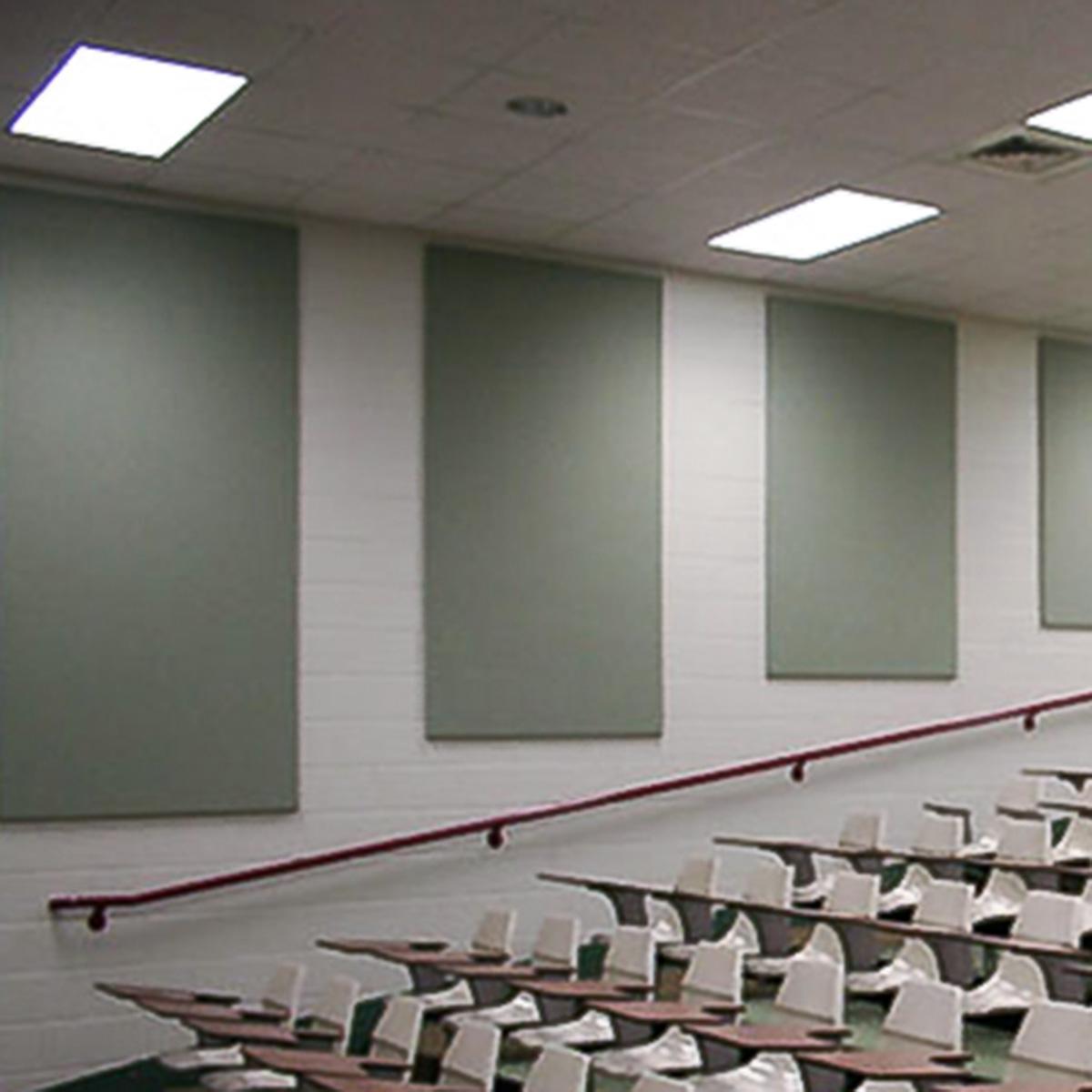 Fabric wrapped acoustic panels on the walls of an auditorium reduce echo and reverberation.