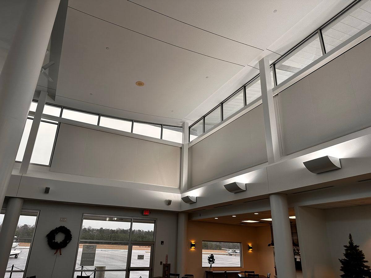 Acoustiwall system installed in the entrance lobby of an aviation facility