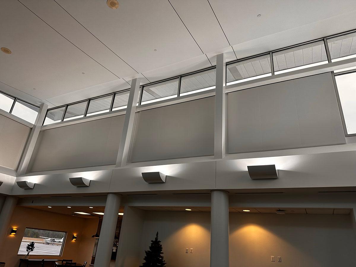 Acoustiwall system installed in the entrance lobby of an aviation facility
