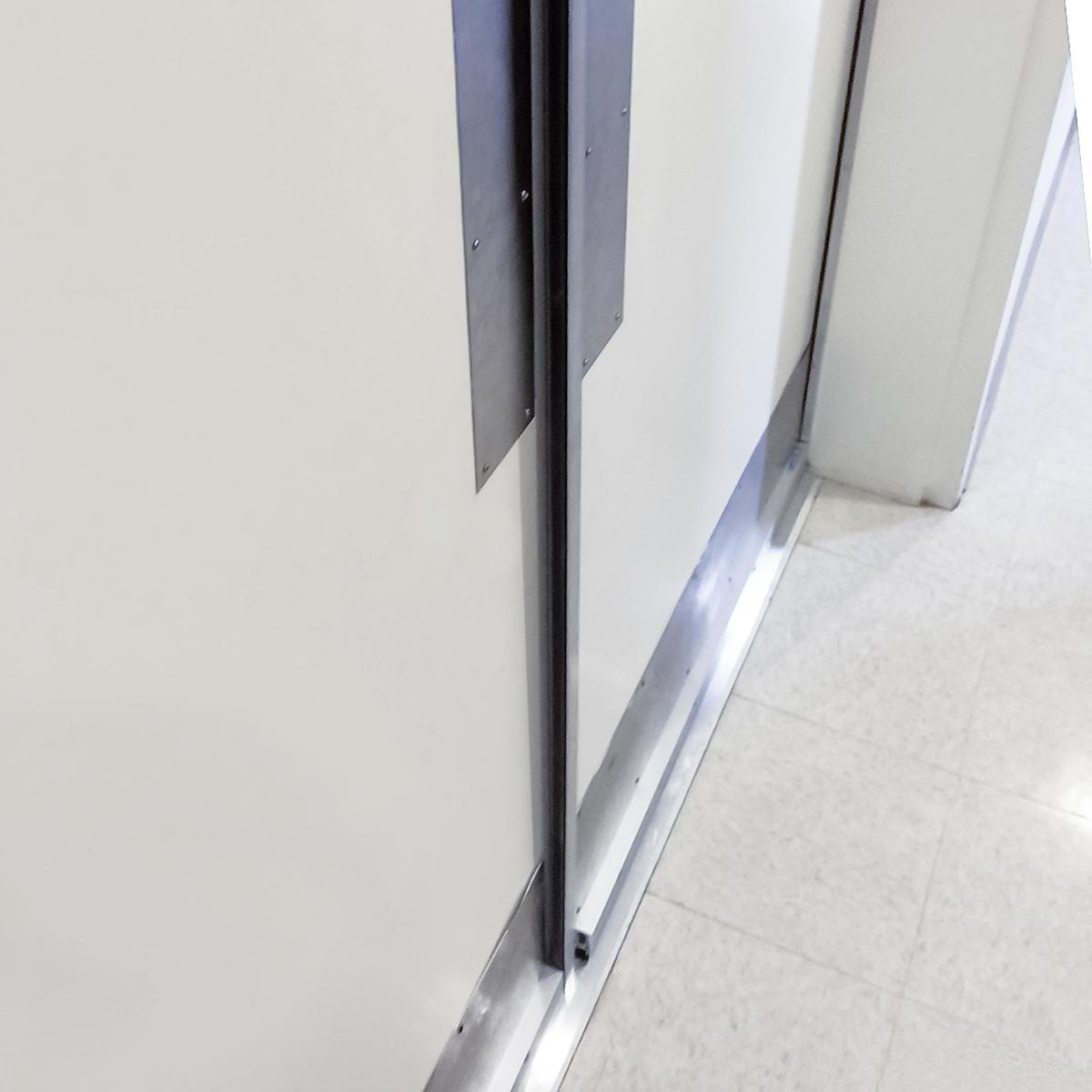 Here a set of double doors are acoustically sealed using 485 jamb seals, a surface mounted door automatic bottom and a 140 astragal for one active door.