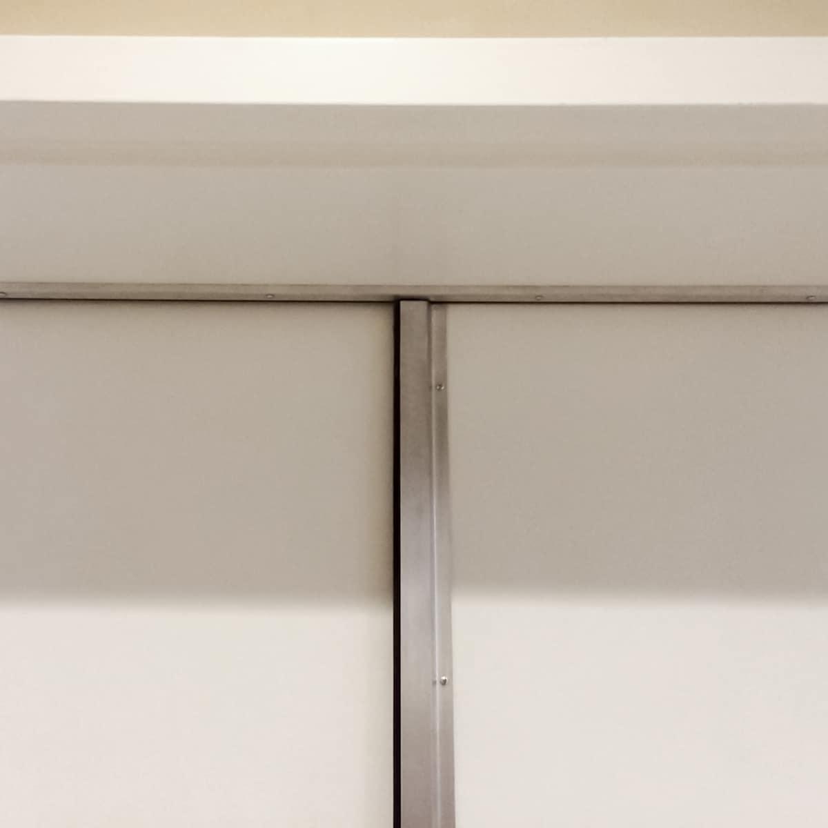 Saint Peter's Catholic Church - Here a set of double doors are acoustically sealed using 485 jamb seals, a surface mounted door automatic bottom and a 140 astragal for one active door. Shown here is the 140 astragal where it meets the 485 jamb seal.