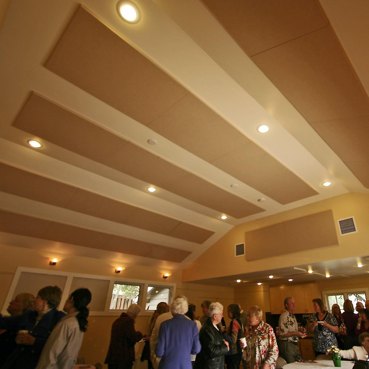At San Geronimo Community Presbyterian Church, fabric wrapped acoustic panels reduce flutter echo.