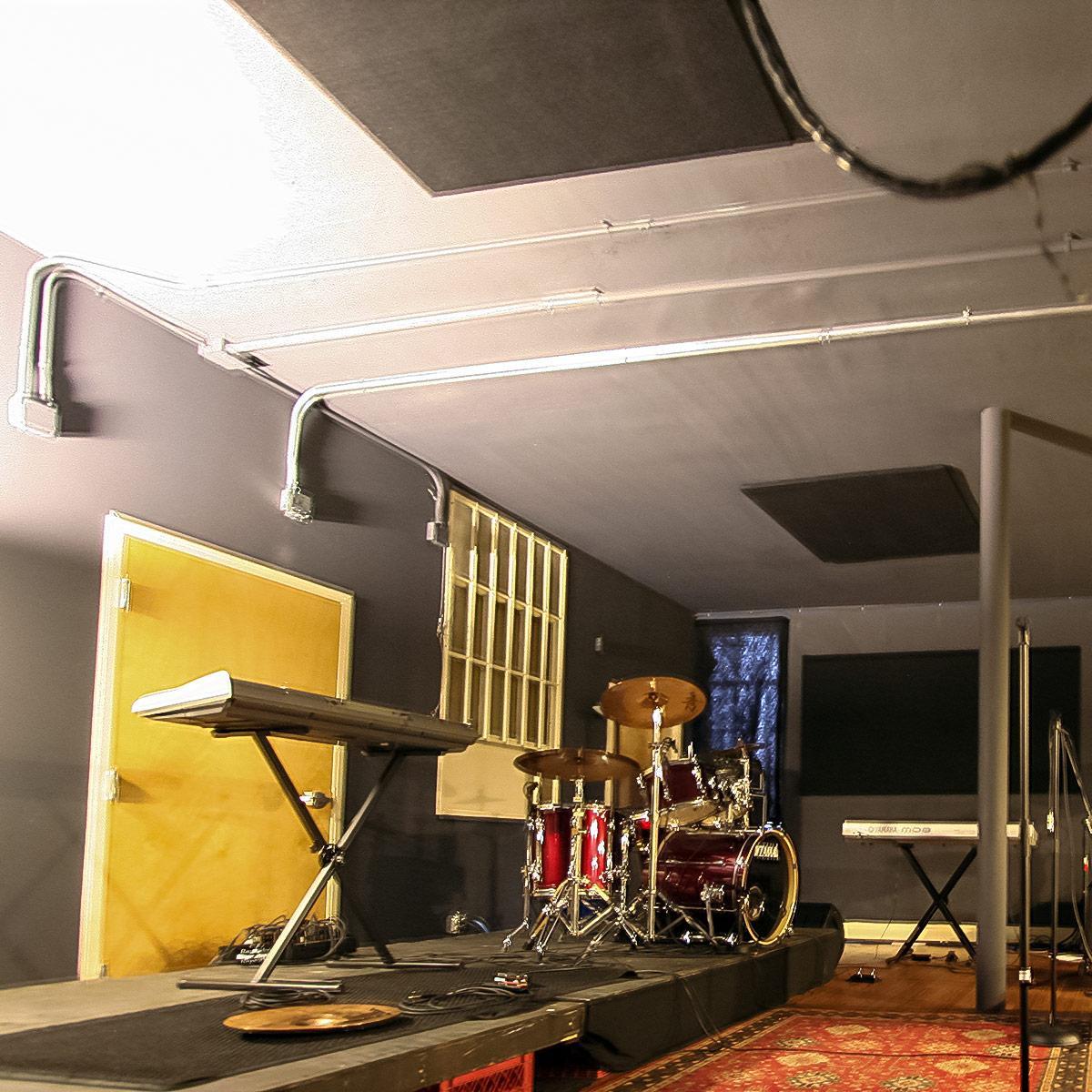 School of Rock - Large open space converted to retail music school using AlphaSorb® and ceiling panels to control sound.