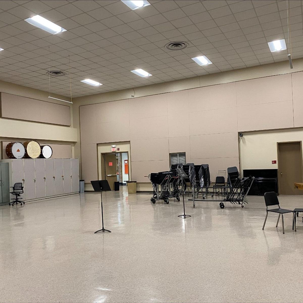 Fabric wrapped panels line the walls of a university's music room to manage the noise from music practice.