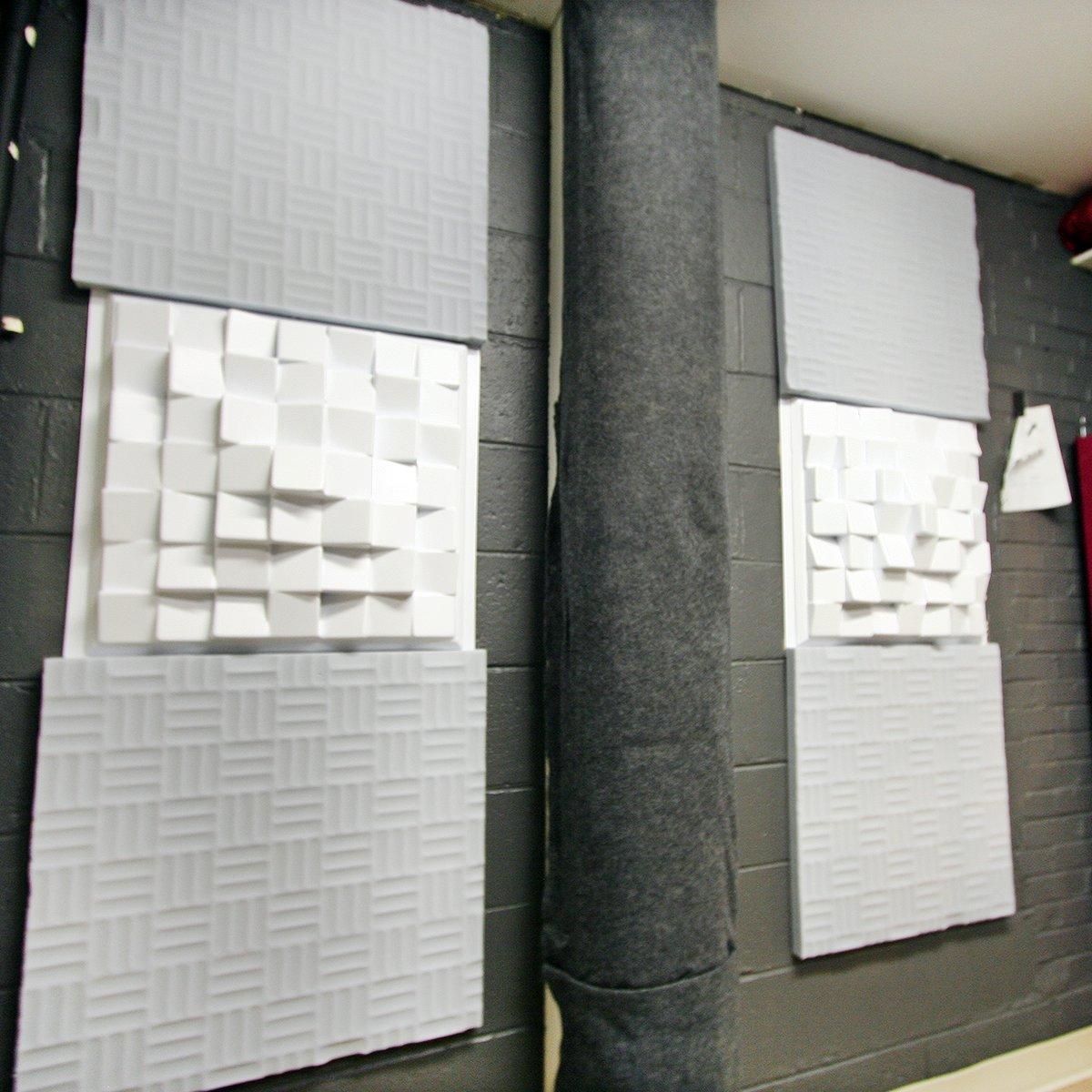 Acoustic foam and sound diffusers on the back wall.