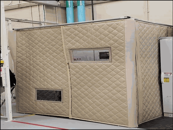 An oversize sound enclosure deadened the high-pitched whine of machinery.