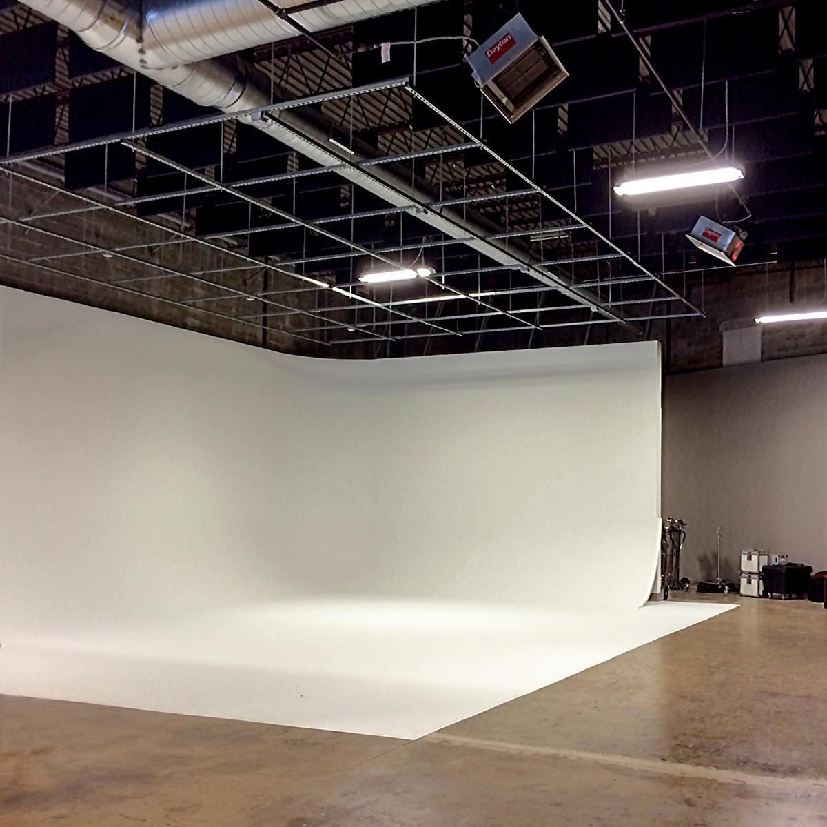 At Spang TV, sound absorbing baffles hung above the Cyclorama Wall reduce noise in the space.