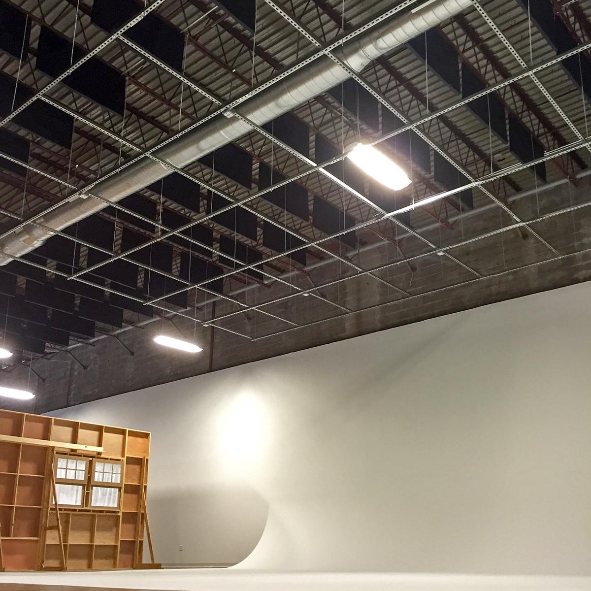 The sound absorbing baffles installed above the  Cyclorama Wall at Spang TV reduce echo and improve the room acoustics.