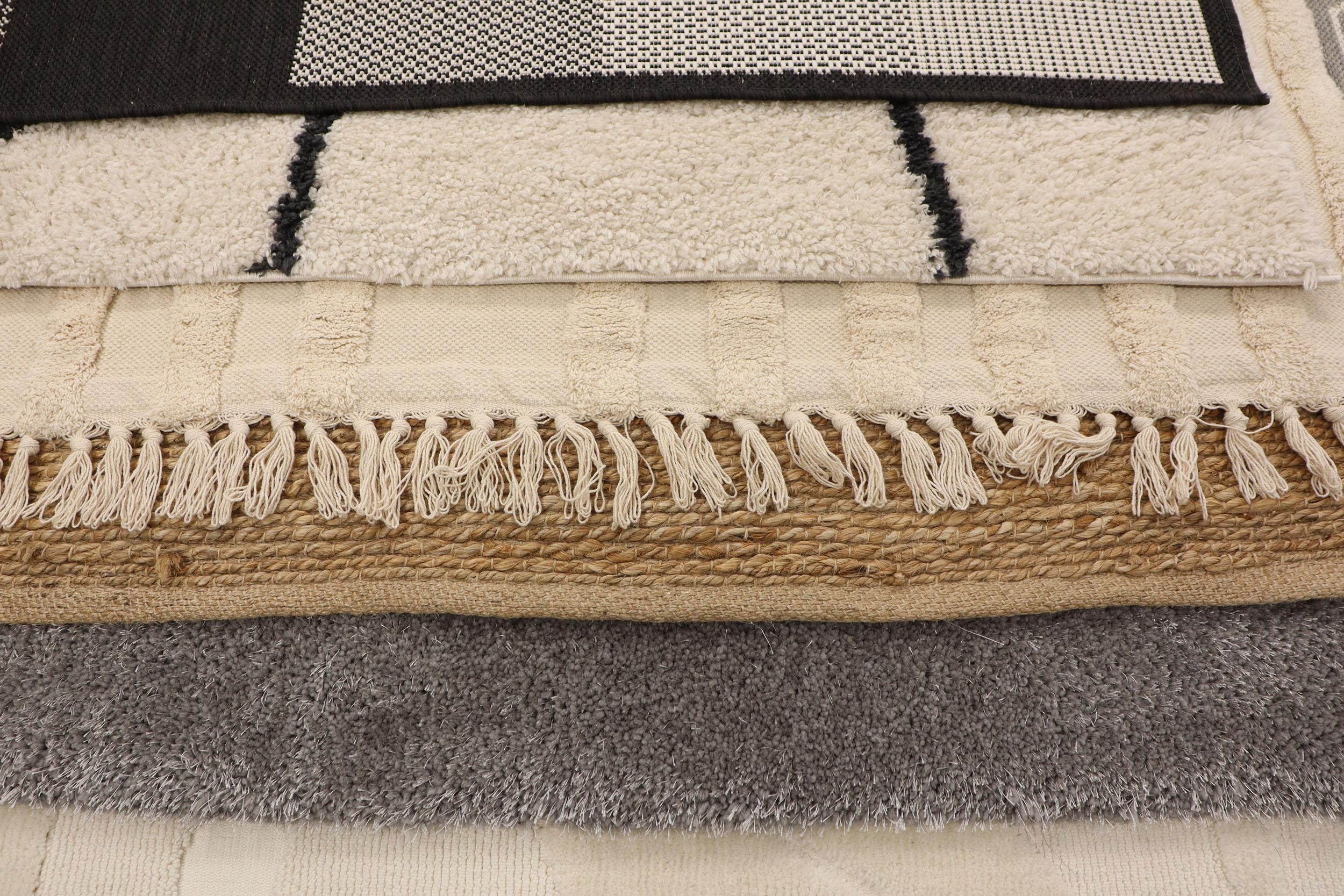 A stack of textured towels and rugs for the home.. Photo by Vadim Cazacu on iStock.