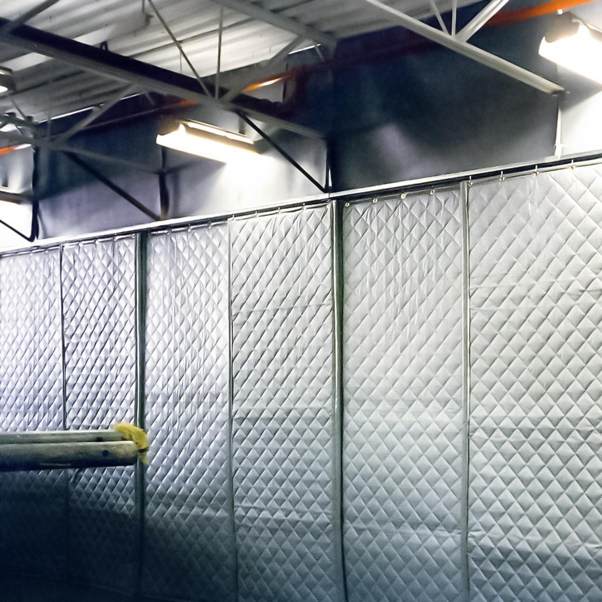 Steel Fabricator — In-plant acoustical wall for reducing equipment noise using AudioSeal® Barrier and absorber blankets.