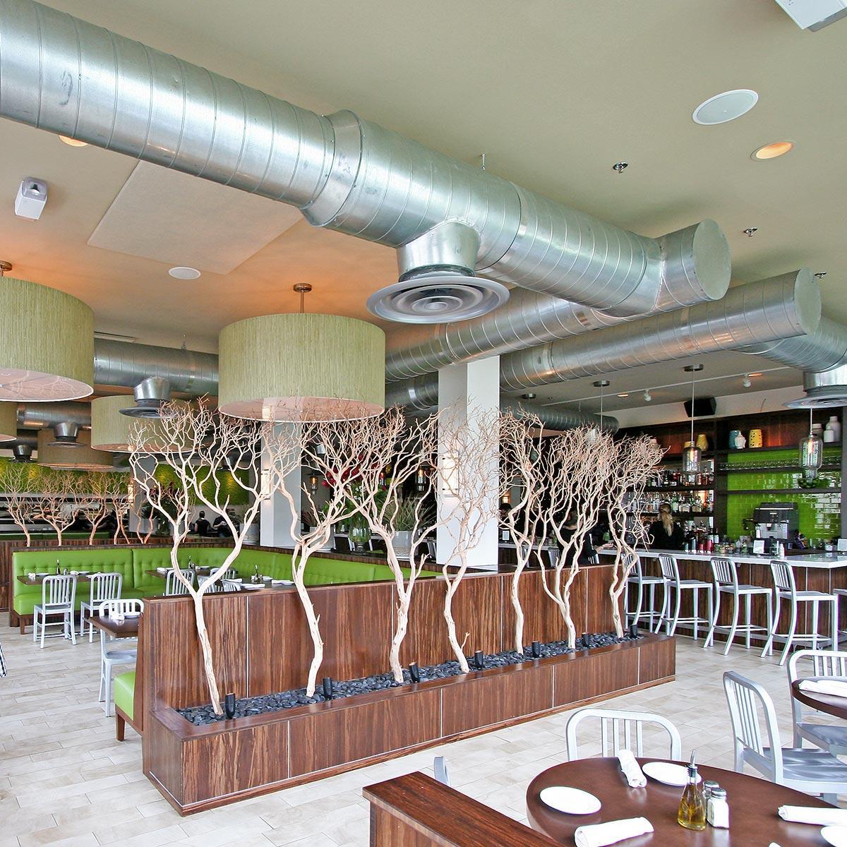 In the Daily Kitchen and Bar, fabric wrapped panels treat the acoustics in the dining room and bar. 
