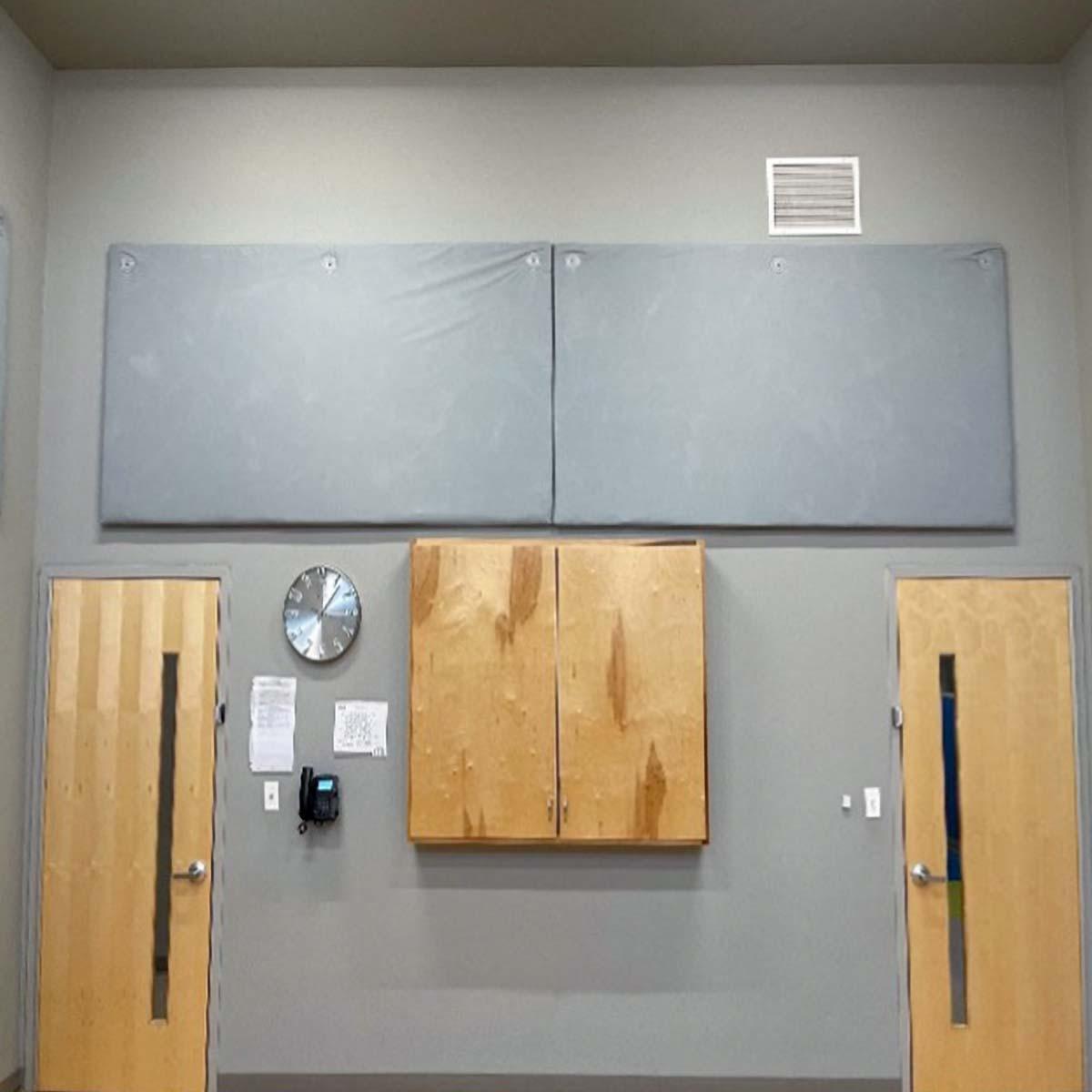 AlphaEnviro RipStop Panels installed in a school multipurpose room to reduce echo.