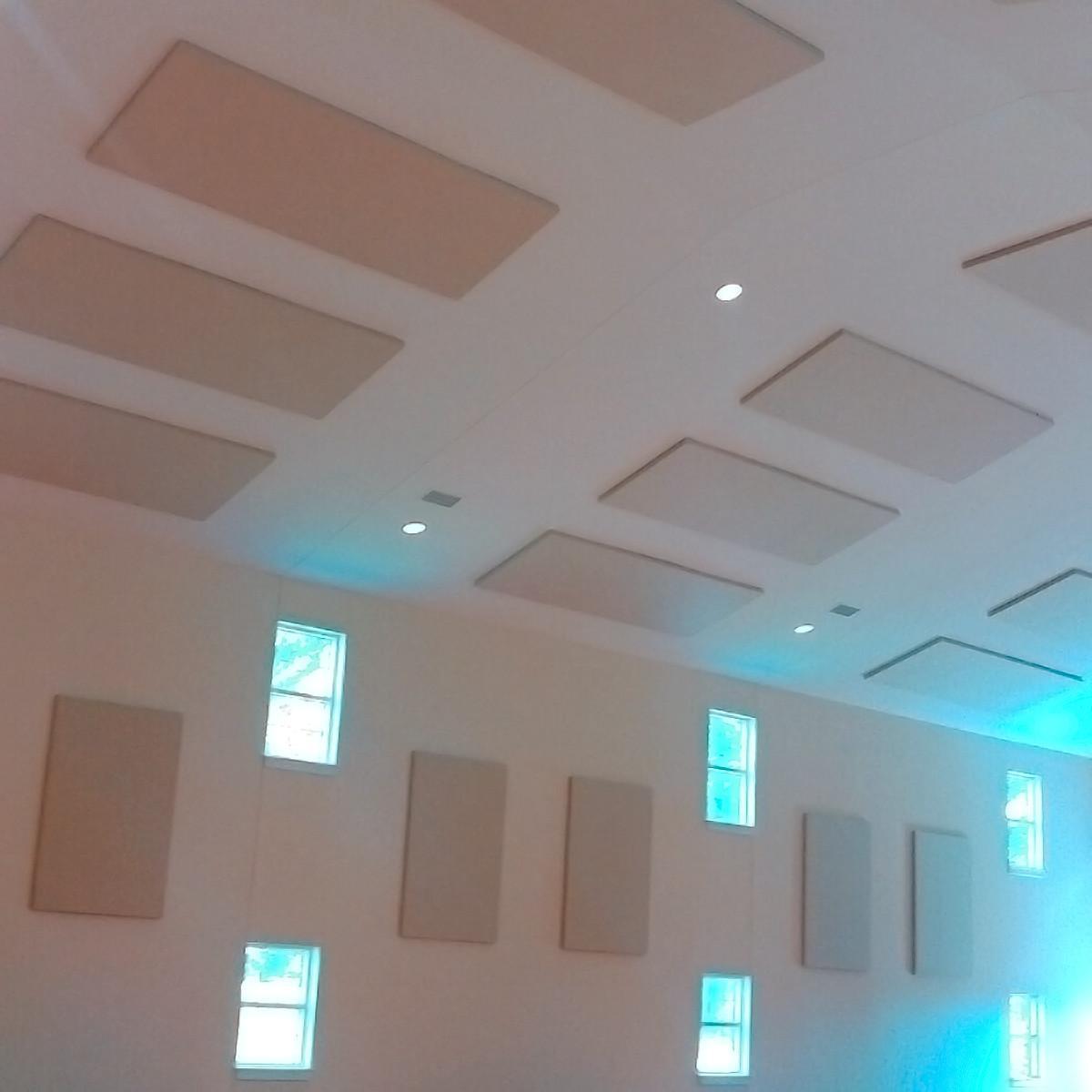 Fabric wrapped acoustic panels on the ceiling and walls in Trinity United Methodist Church.
