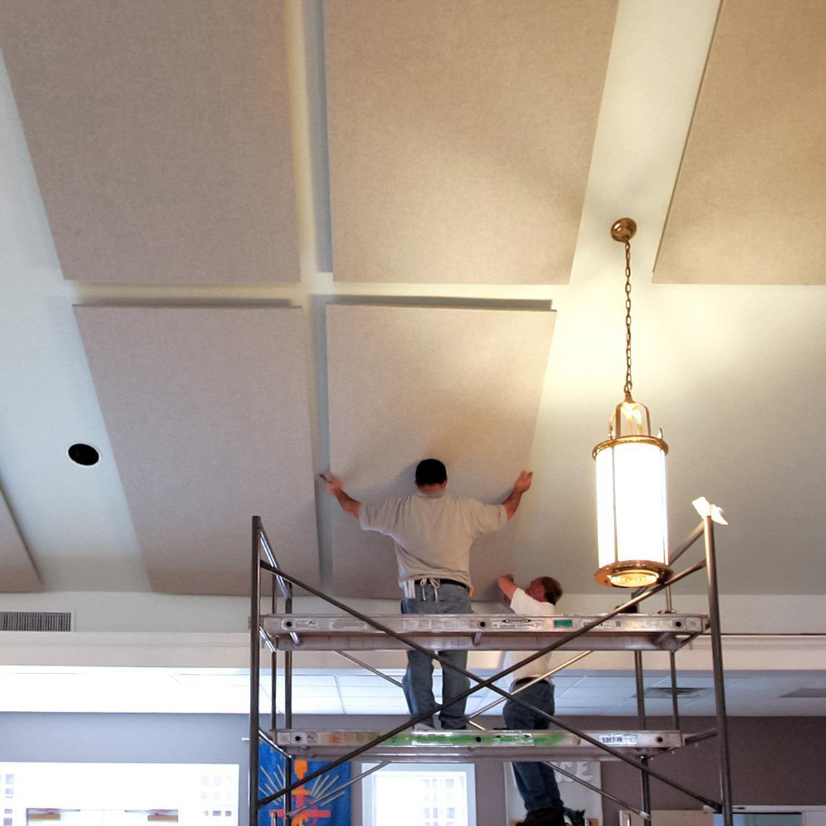 Fabric acoustic panels being installed at Tuckahoe Presbyterian Church to reduce reverberation.