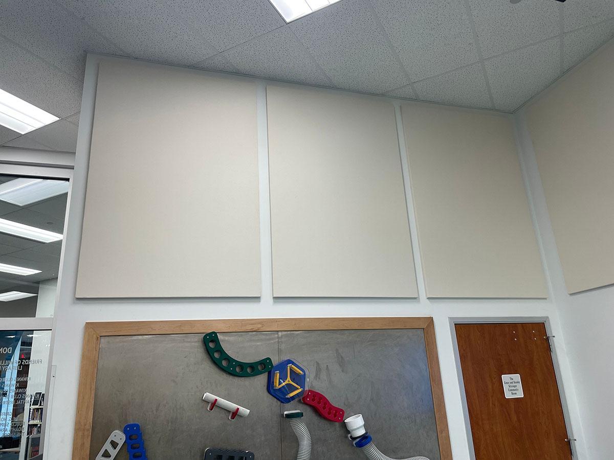 Fabric wrapped acoustic panels on the walls in the children's area of the Williamsburg Regional Library.