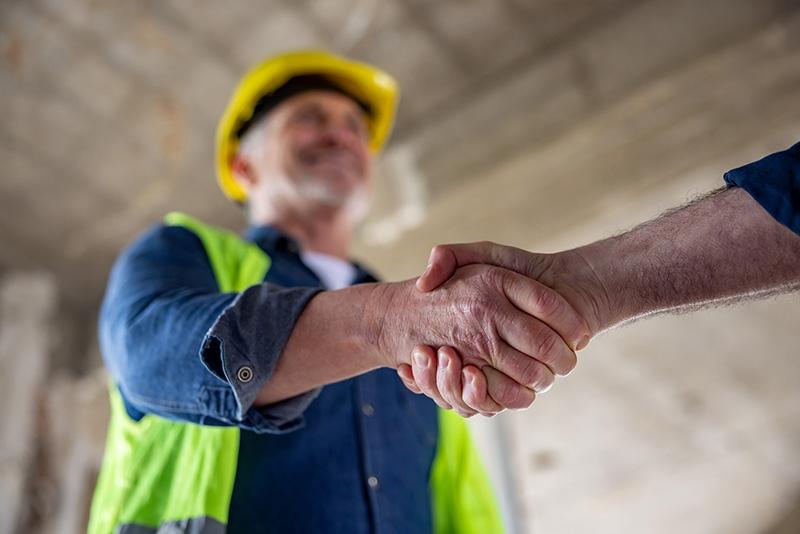 Contractor shaking hands with another man