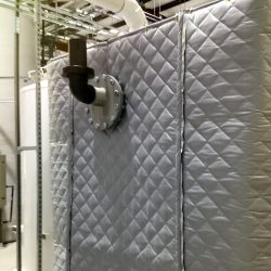 AECOM Industrial Plant - Acoustical blanket wall using AudioSeal® blankets to block noise from equipment, reducing the noise for the employees in plant.