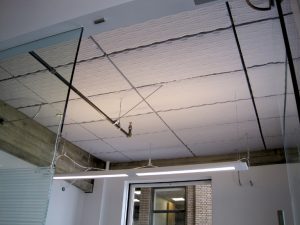 Sonex Valueline Acoustical foam direct mounted to a concrete ceiling to improve this office's acoustical environment.