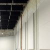 Spang TV installed 4' x 5' x 2 in. thick fabric wrapped acoustic panels around the perimeter wall in the main production space to absorb sound and create a dynamic space for filming.