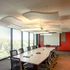 At Verisk Health, the Whisperwave® Ceiling Clouds and Anchorage panels offer a clean design element and improve the room for teleconferencing.