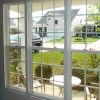 PrivacyShield® Window Seal Kit installed over three double hung windows.