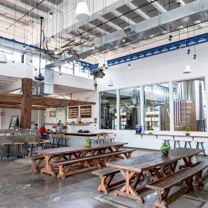 Väsen Brewing Company improved the acoustics in their commercial taproom by installing two-inch thick fabric wrapped acoustical panels up in the ceiling.